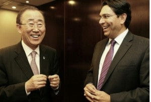 U.N. Secretary General Ban Ki-moon holds a nano Bible presented to him by Israeli envoy Danny Danon